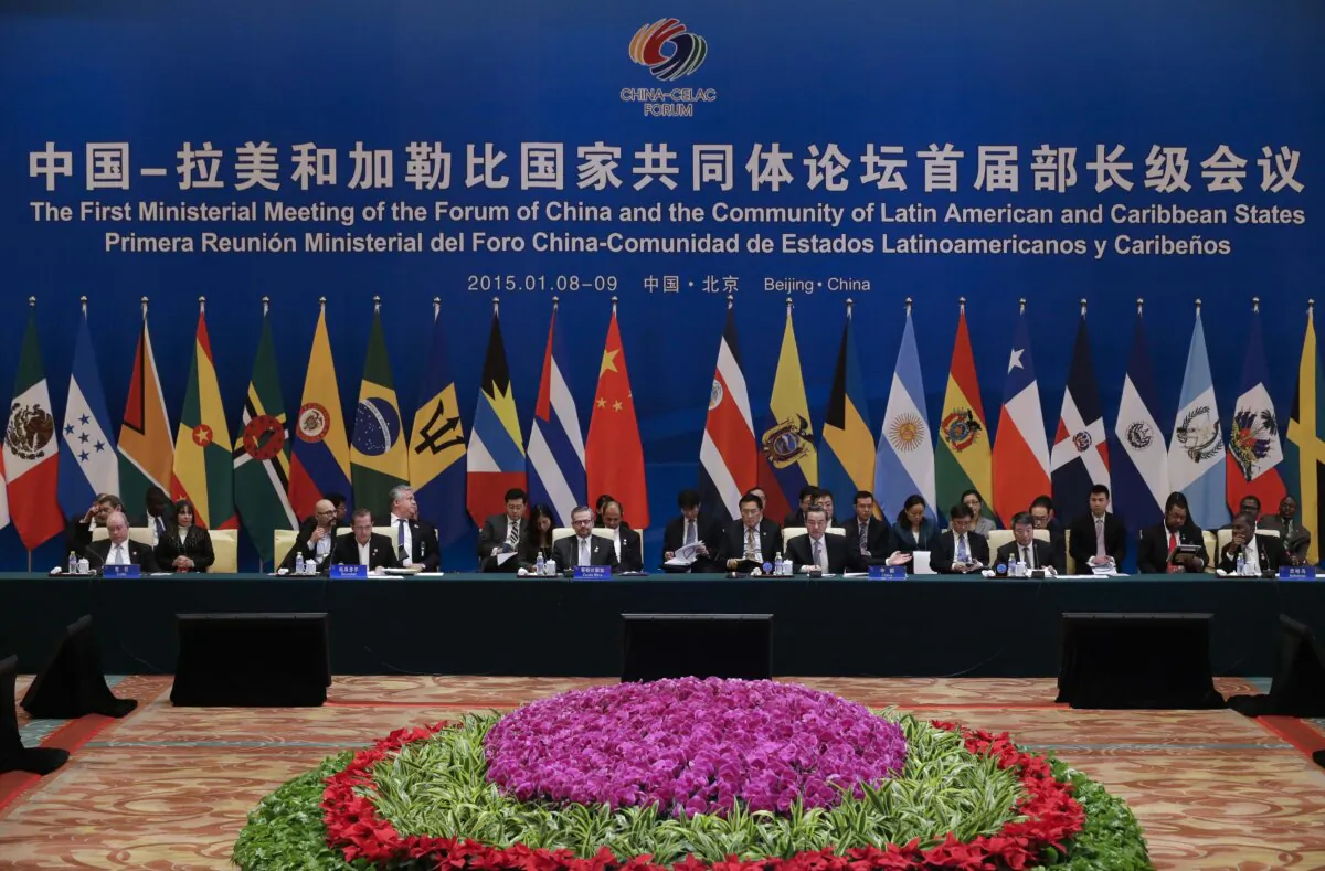 (Front seated L-R) Cuban Minister of Foreign Trade Rodrigo Malmierca, Ecuadorian Foreign Minister Ricardo Patino, Costa Rican Foreign Minister Manuel Gonzalez Sanz, Chinese Foreign Minister Wang Yi, Chinese Director of National Development and Reform Commission Xu Shao Shi and Bahamas Foreign Minister Frederick Mitchell attend the First Ministerial Meeting of the Forum of China and the Community of Latin American and Caribbean States (China-CELAC) at the Diaoyutai Guesthouse in Beijing on January 6, 2015. (Rolex Dela Pena/AFP via Getty Images)