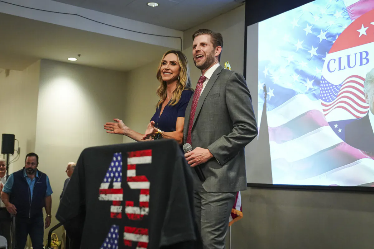 Lara Trump (L) and her husband, Eric Trump (R), speak at an event in Palm Beach County, Fla., on Feb. 12, 2024. (Madalina Vasiliu/The Epoch Times)
