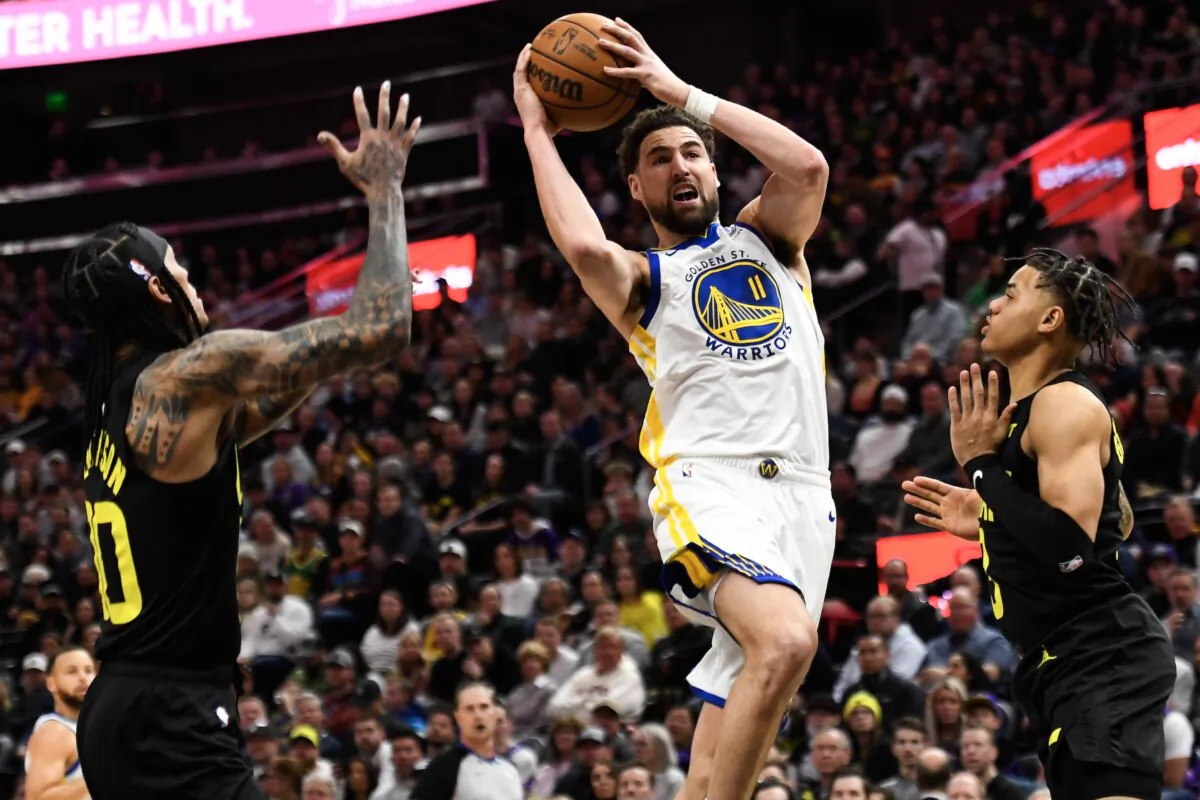Klay Thompson (11) of the Golden State Warriors goes up for a shot against Keyonte George (3) of the Utah Jazz during the first half in Salt Lake City, Utah on Feb. 12, 2024. (Alex Goodlett/Getty Images)