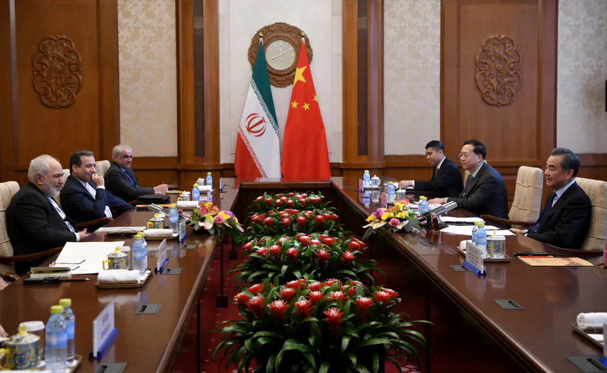 Iran's Foreign Minister Mohammad Javad Zarif talks to China's Foreign Minister Wang Yi during their meeting at the Diaoyutai State Guest House in Beijing, on Dec. 31, 2019. (Noel Celis/AFP via Getty Images)