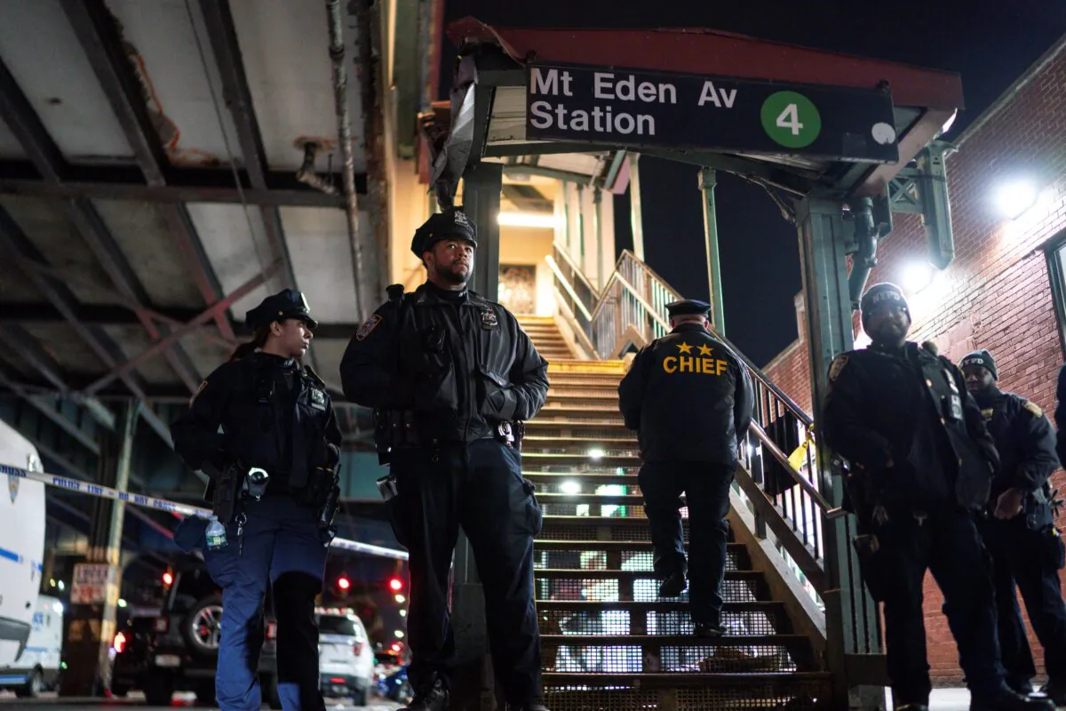 New York City Police officers stand guard following a shooting at the Mount Eden subway station in the Bronx borough of New York on Feb. 12, 2024. (Eduardo Munoz Alvarez/AP Photo)
