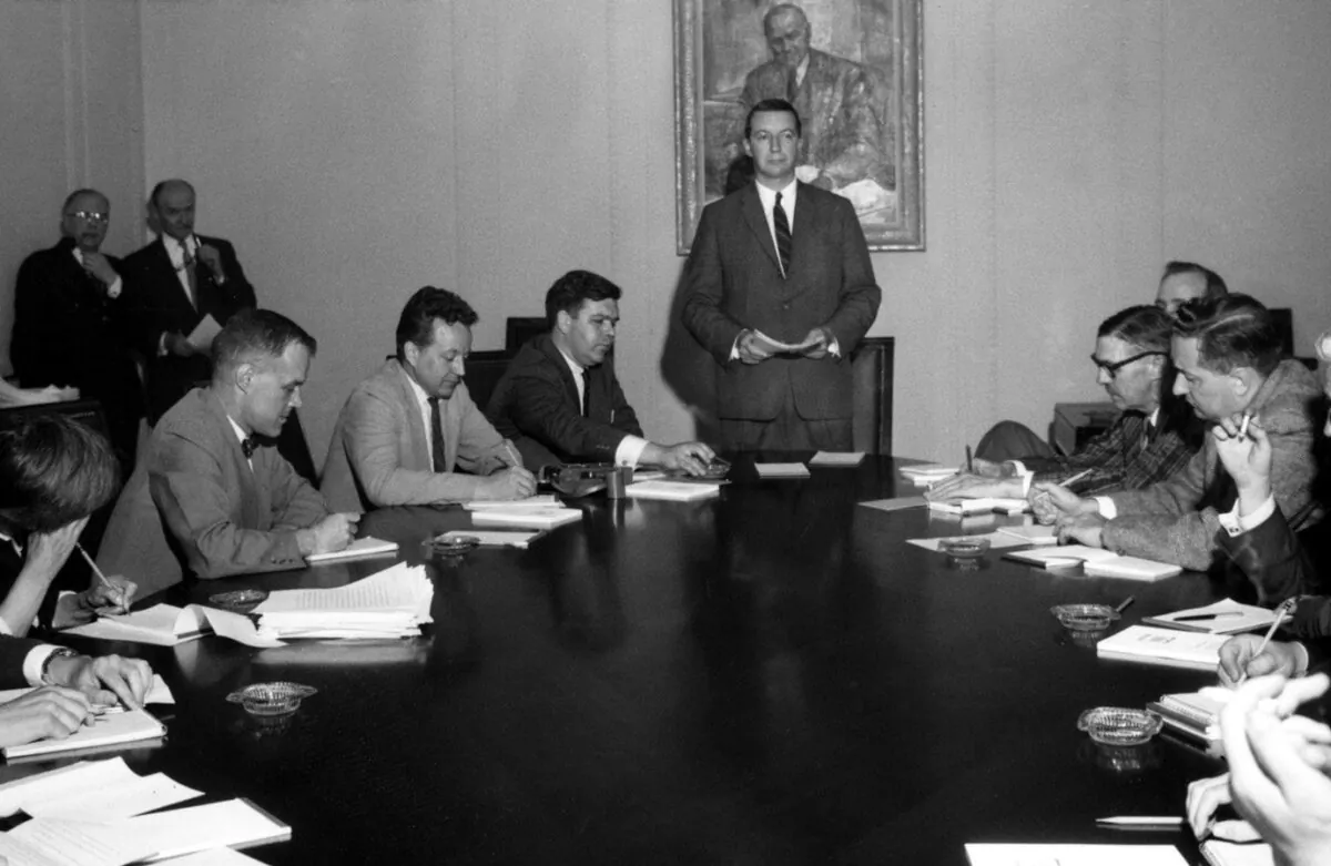 Bank of Canada Governor James E. Coyne (C) holds a press conference in Ottawa on June 13, 1961, in connection with his statement that he had been asked to resign but had refused. He stepped down a month later. (CP PHOTO) 