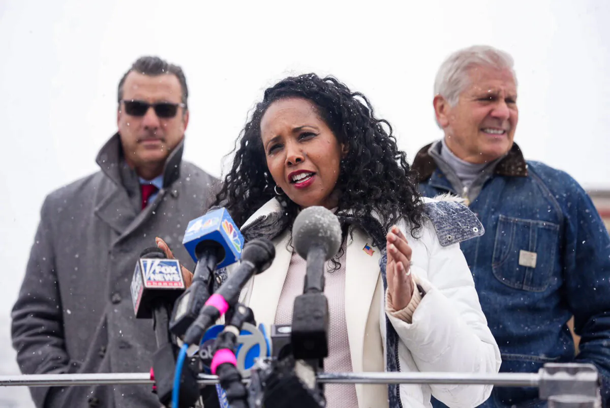 Mazi Pilip (C) on the campaign trail outside the McKenna Elementary School at a press conference in Massapequa, N.Y., on Feb. 13, 2024. (Samira Bouaou/The Epoch Times)