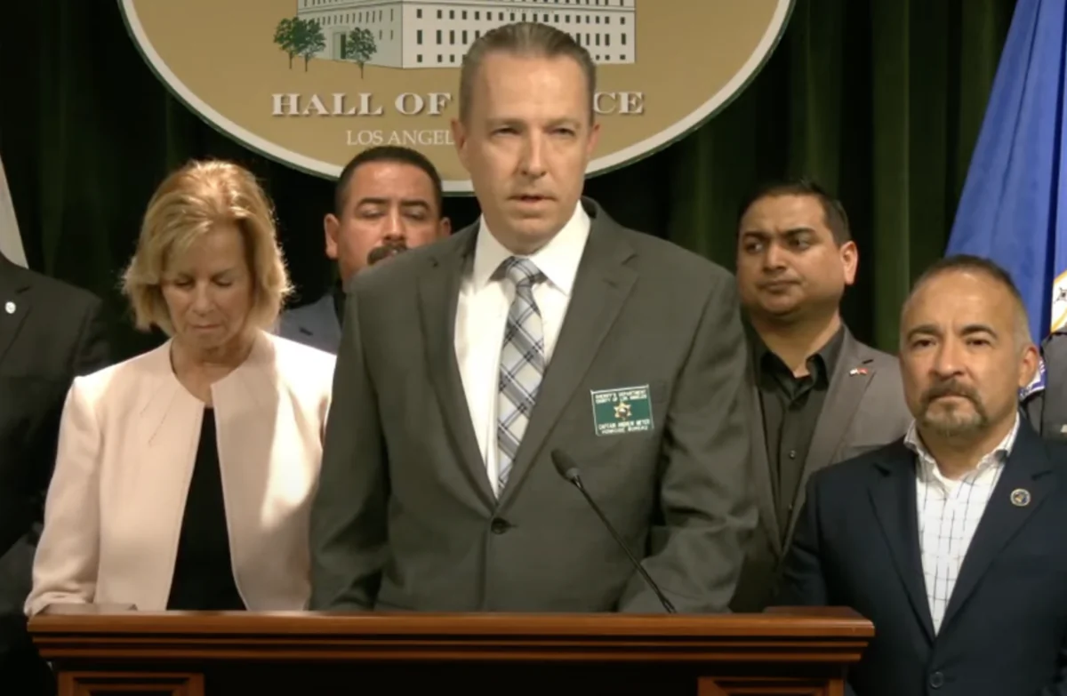 Los Angeles County Sheriff’s Department Homicide Capt. Andrew Meyer speaks during a news conference announcing the arrest of two individuals linked to four killings across Bell, Florence-Firestone, Cudahy, and Huntington Park at the Hall of Justice in downtown Los Angeles on Feb. 13, 2024. (YouTube/Screenshot via The Epoch Times)