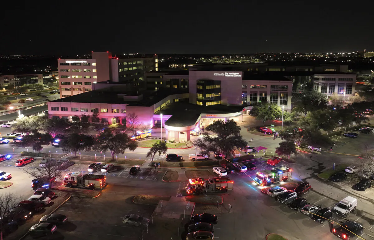 First responders work the scene after a car crashed into an emergency room at St. David's North Austin Medical Center, on Tuesday, Feb. 13, 2024. (Jay Janner/Austin American-Statesman via AP)