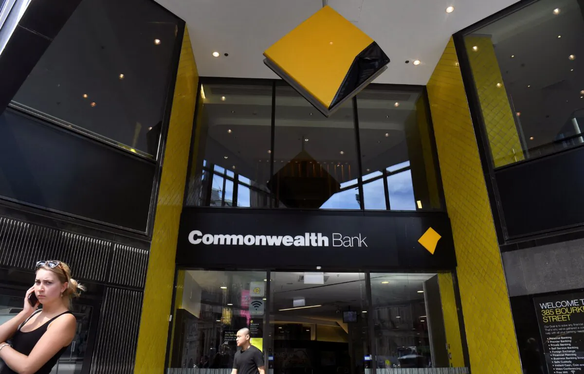 People walk past a branch of the Commonwealth Bank in Melbourne, Australia, on Feb. 6, 2019. (William West/AFP via Getty Images)
