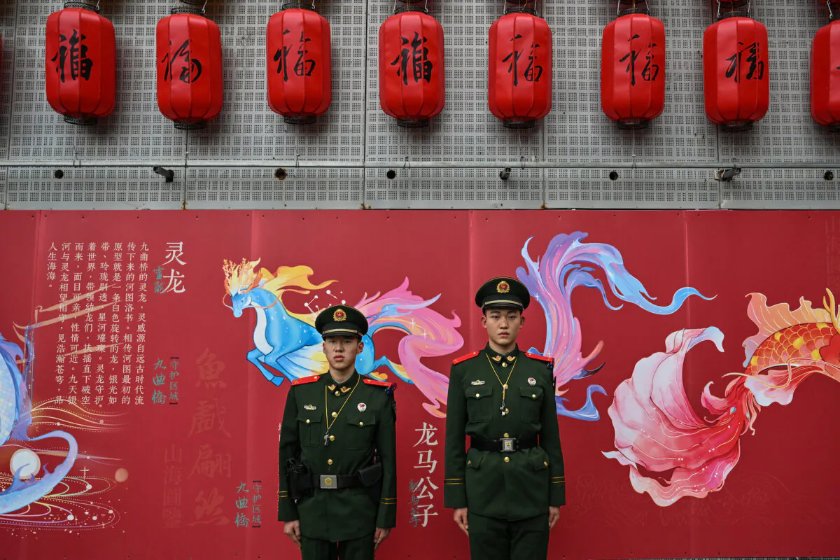 Chinese paramilitary policemen stand guard as people visit the Yu Garden during the fourth day of the Lunar New Year of the Dragon in Shanghai, China, on Feb. 13, 2024. (Hector Retamal/AFP via Getty Images)