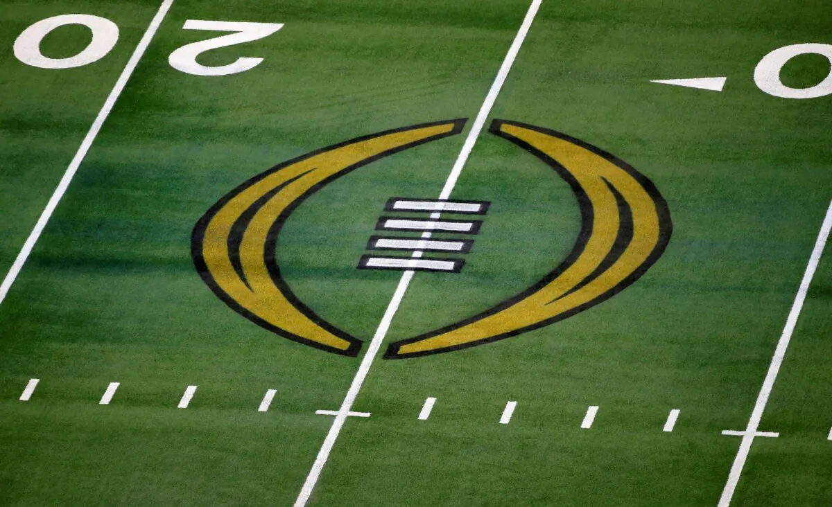 The College Football Playoff logo on the field at AT&T Stadium before the Rose Bowl NCAA college football game between Notre Dame and Alabama in Arlington, Texas, on Jan. 1, 2021. (Roger Steinman/AP Photo)