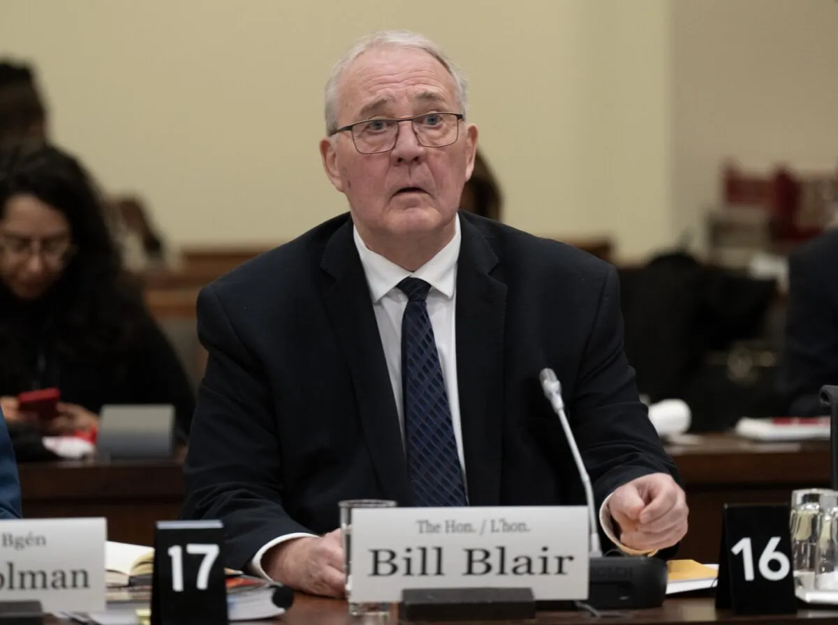 Defence Minister Bill Blair waits to appear as a witness at the Standing Committee on National Defence, in Ottawa on Feb. 12, 2024. (The Canadian Press/Adrian Wyld)