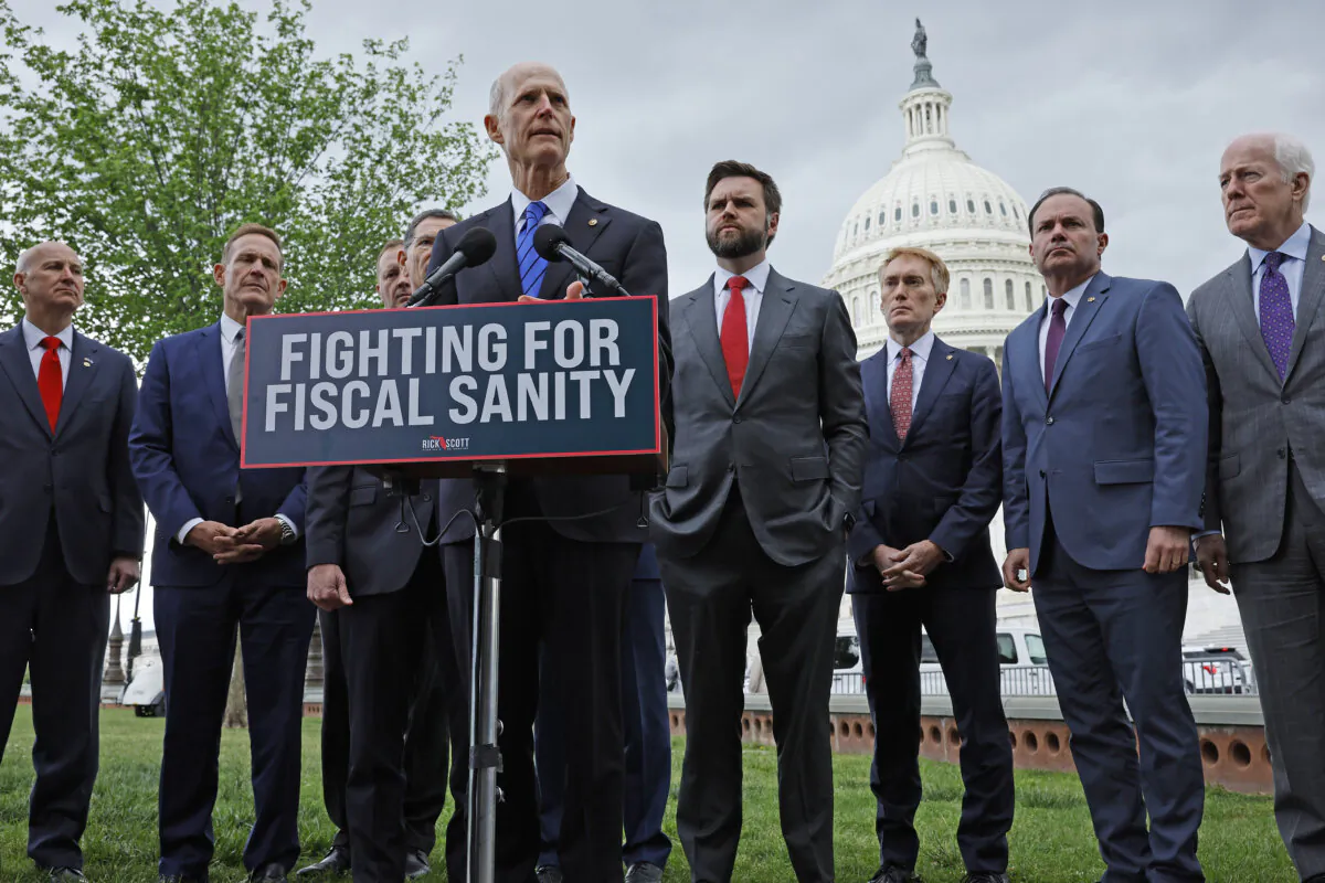 Sen. Rick Scott (R-Fla.) is joined by fellow Senate Republicans for a May 3, 2023, news conference where he urged the White House and Senate Democrats to pass House GOP legislation that would raise the debt limit but cut federal spending. More than nine months later, federal fiscal sanity is still in short supply. (Chip Somodevilla/Getty Images)