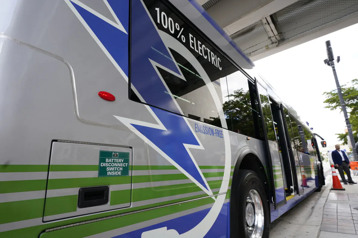 A Proterra ZX5 battery-powered electric bus was parked in downtown Miami on Feb. 2, 2023. The City of Edmonton is seeking $82 million in damages over failures in operations of electric buses acquired from the company. (AP Photo/Wilfredo Lee)