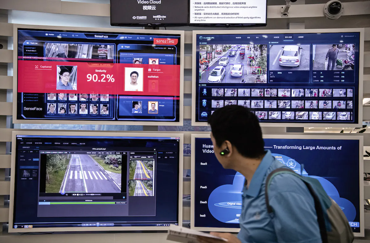 A display for facial recognition and artificial intelligence is seen on monitors at Huawei's Bantian campus on April 26, 2019 in Shenzhen, China. (Kevin Frayer/Getty Images)While commercially successful and a dominant player in 5G, or fifth-generation networking technology, Huawei has faced political headwinds and allegations that its equipment includes so-called backdoors that the U.S. government perceives as a national security. U.S. authorities are also seeking the extradition of Huaweis Chief Financial Officer, Meng Wanzhou, to stand trial in the U.S. on fraud charges. Meng is currently under house arrest in Canada, though Huawei maintains the U.S. case against her is purely political. Despite the U.S. campaign against the company, Huawei is determined to lead the global charge toward adopting 5G wireless networks.  It has hired experts from foreign rivals, and invested heavily in R&D to patent key technologies to boost Chinese influence. (Photo by Kevin Frayer/Getty Images)