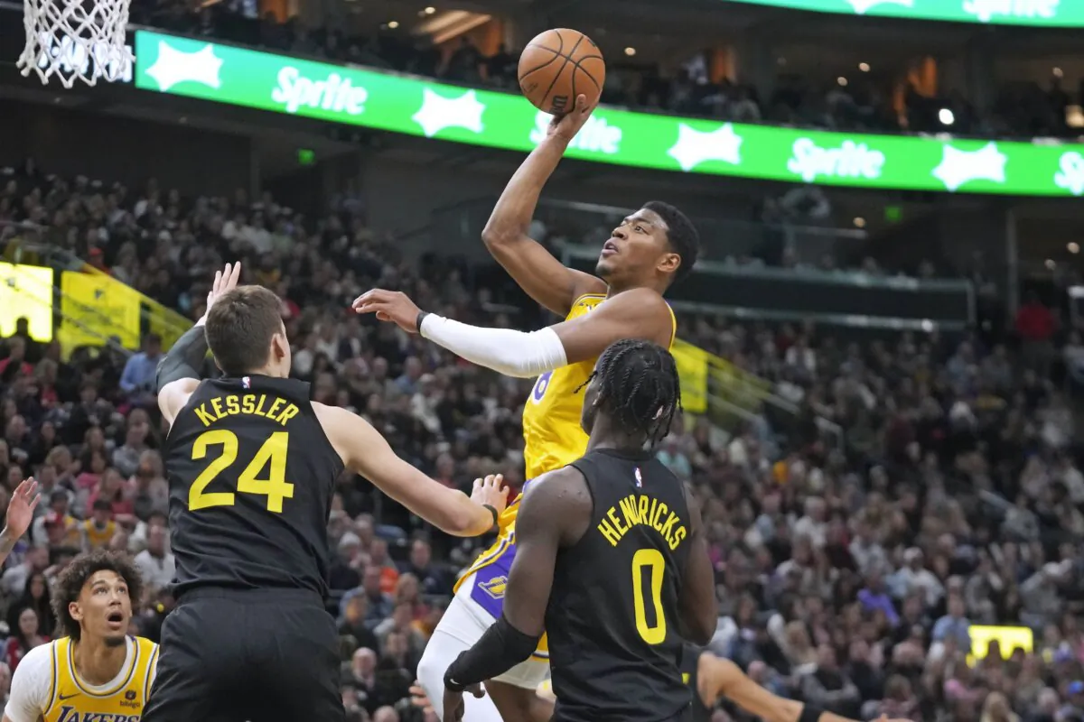 Los Angeles Lakers forward Rui Hachimura (28) goes to the basket as Utah Jazz's Walker Kessler (24) and Taylor Hendricks (0) defend during the first half of an NBA basketball game in Salt Lake City on Feb. 14, 2024. (Rick Bowmer/AP Photo)