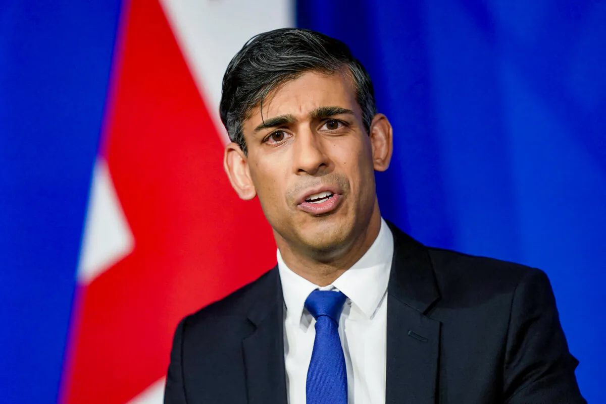 Britain's Prime Minister Rishi Sunak hosts a press conference inside the Downing Street Briefing Room after Britain and Rwanda sign a new treaty to transfer illegal immigrants to the African country, in central London, on Dec. 7, 2023. (James Manning/POOL/AFP via Getty Images)