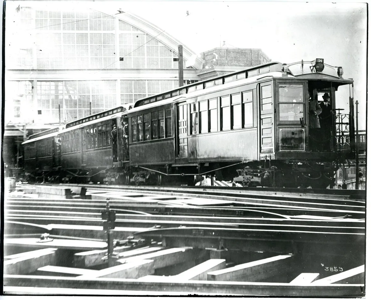 A 1900 test of a multi-unit control train motor in Sullivan Square station in Boston, Massachusetts. The figure on the far right is believed to be Frank J. Sprague, the unit's inventor. (Public Domain)