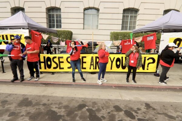 Workers said they never imagined transitioning from serving tourists in a five-star hotel, to serving the city’s homeless population. (Beige Luciano Adams/The Epoch Times)