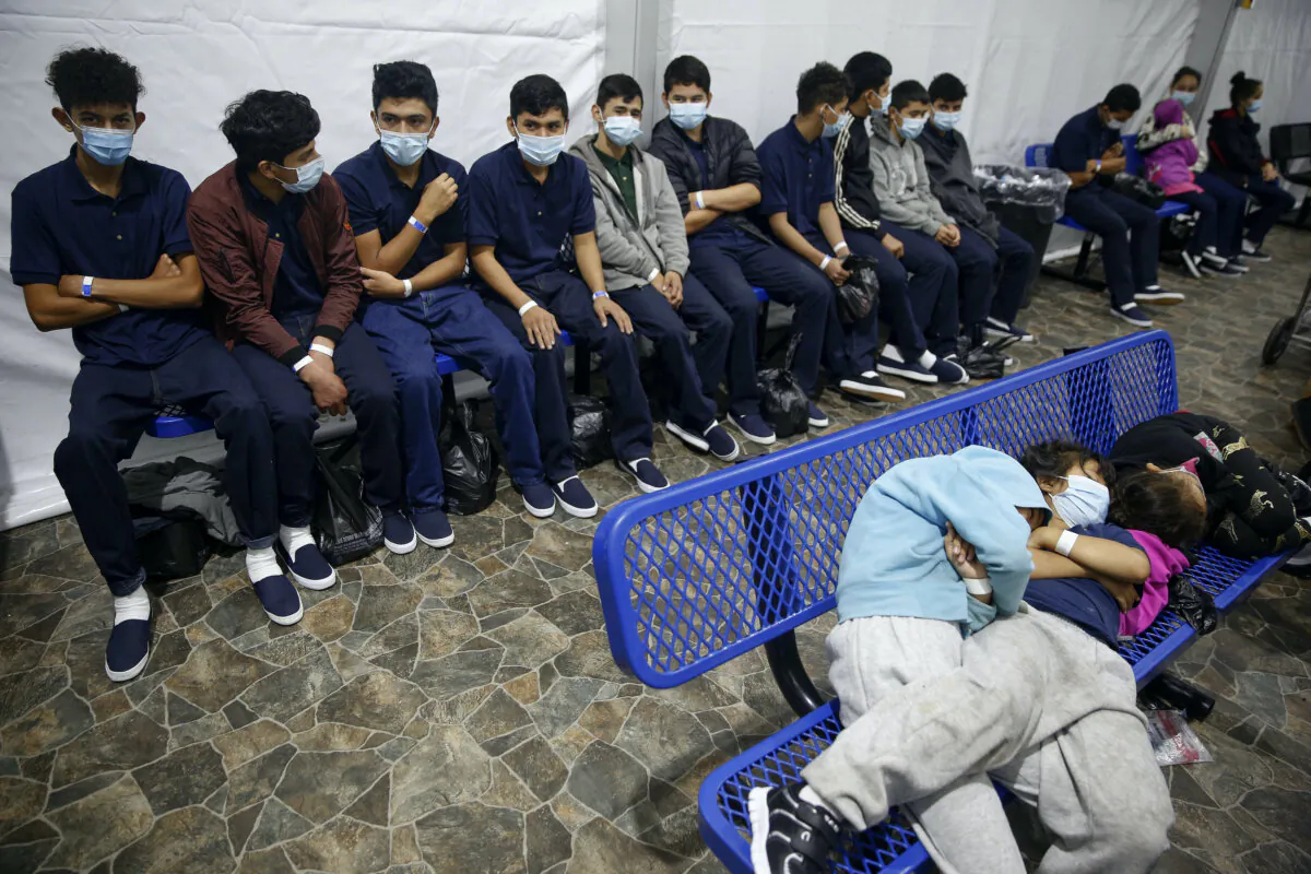 Unaccompanied alien children wait for their turn at the secondary processing station inside the Donna Department of Homeland Security holding facility, the main detention center for unaccompanied children in the Rio Grande Valley in Donna, Texas, on March 30, 2021. (Dario Lopez-Mills/AP Photo)