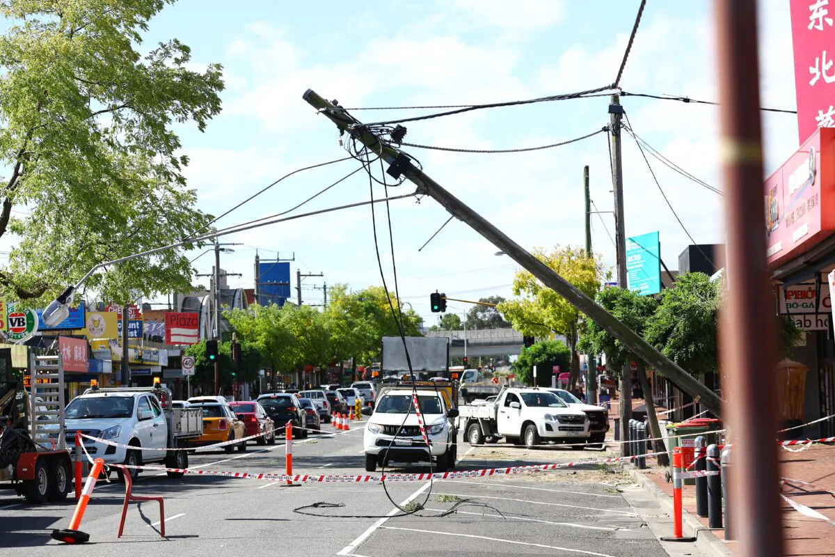 A damaged power pole is seen in Melbourne, Australia, on Feb. 14, 2024. (AAP Image/Con Chronis)