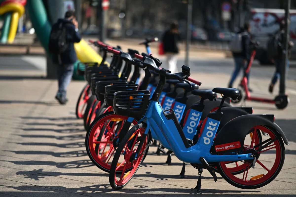 Electric bicycles are parked on a sidewalk in Milan, Italy, on March 22, 2023. (Gabriel Bouys/AFP via Getty Images)