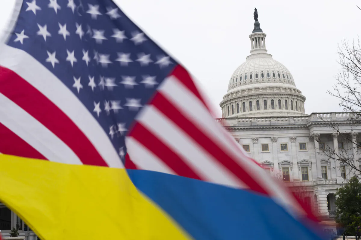 Ukraine sympathizers fly a Ukrainian flag outside as the Senate works through the weekend on a $95.3 billion foreign aid bill with assistance for Ukraine and Israel at the U.S. Capitol, in Washington, D.C., on Feb. 11, 2024. (Tribune Content Agency)