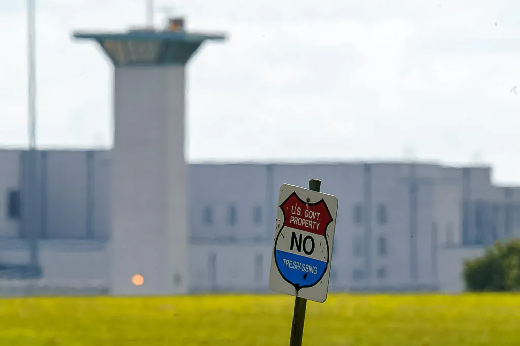 A No Trespassing sign stands in front the federal prison complex in Terre Haute, Ind., on Aug. 26, 2020. (Michael Conroy/AP Photo)