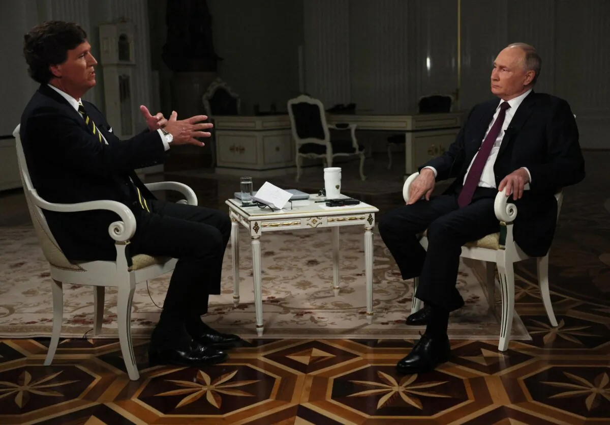 Russia's President Vladimir Putin gives an interview to U.S. talk show host Tucker Carlson at the Kremlin in Moscow on Feb. 6, 2024. (Gavriil Grigorov/Sputnik/AFP via Getty Images)