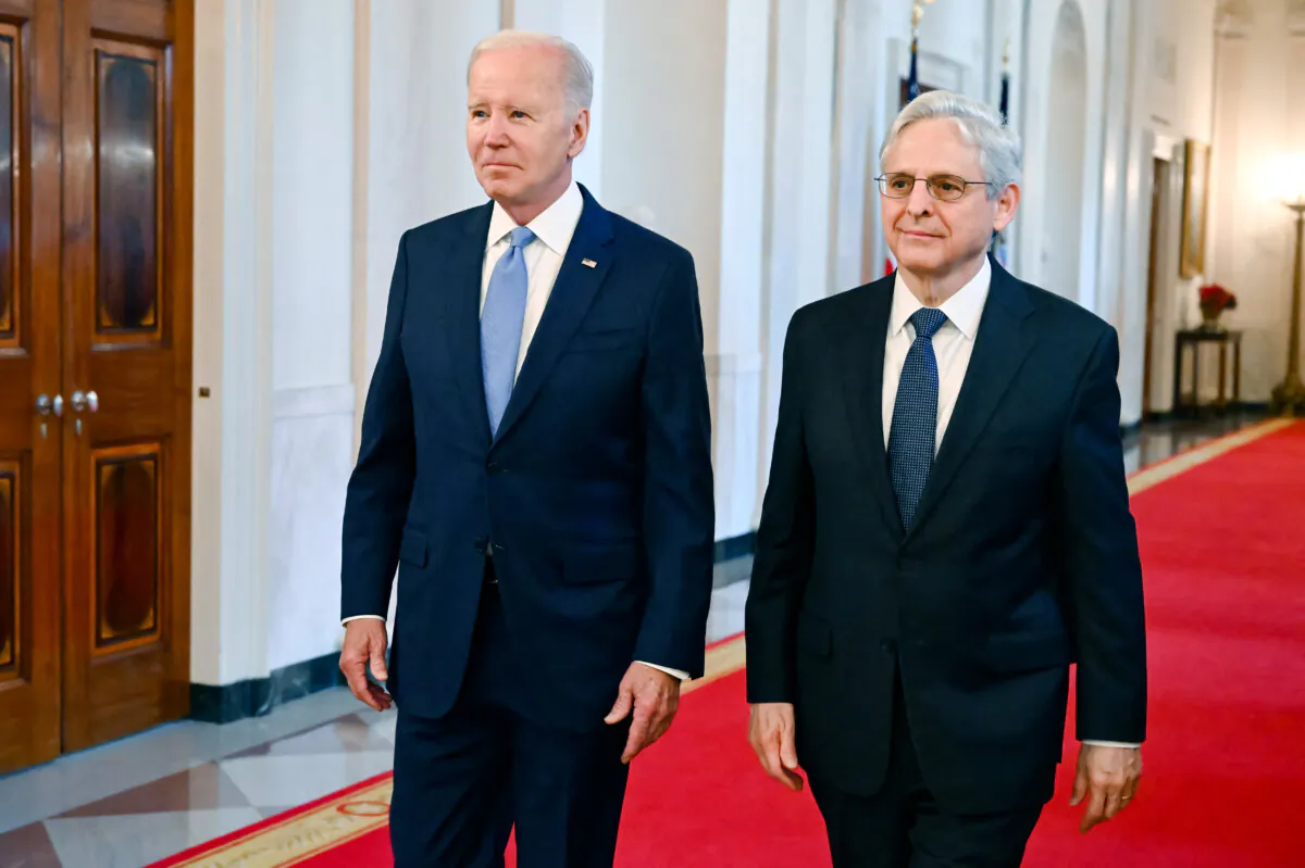 US President Joe Biden (L) and Attorney General Merrick Garland arrive for a ceremony to honor the 2021-2022 Medal of Valor recipients in the East Room of the White House in Washington, DC, on May 17, 2023. (Photo by SAUL LOEB / AFP) (Photo by SAUL LOEB/AFP via Getty Images)