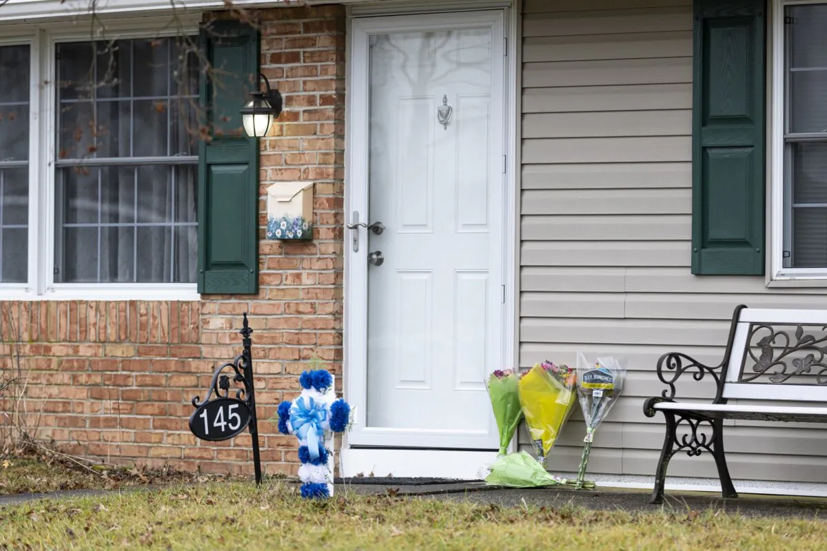 Flowers rest at the front door of the Mohn residence in Upper Orchard section in Levittown, Pa., on Feb. 2, 2024. (Tyger Williams/The Philadelphia Inquirer via AP)