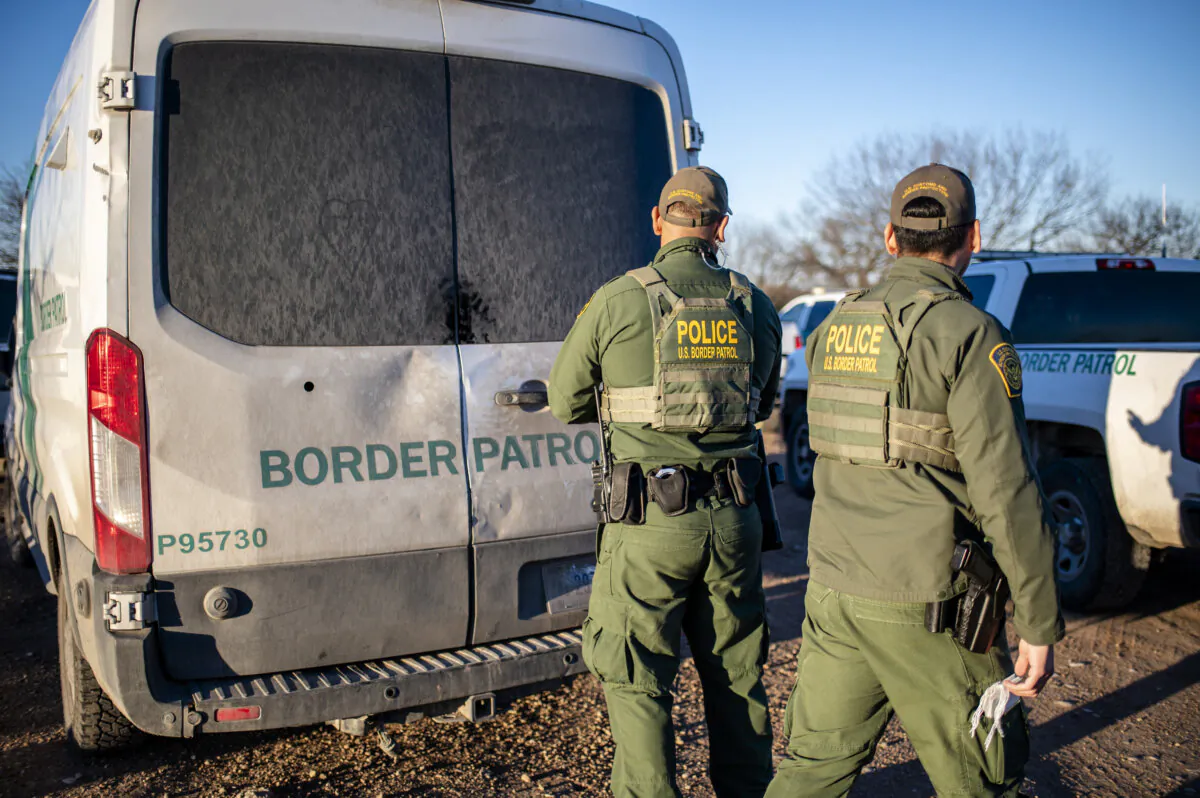 Border Patrol processes a group of about 60 migrants near the highway outside Eagle Pass, Texas, on Feb. 4, 2024. (Sergio Flores/AFP via Getty Images)