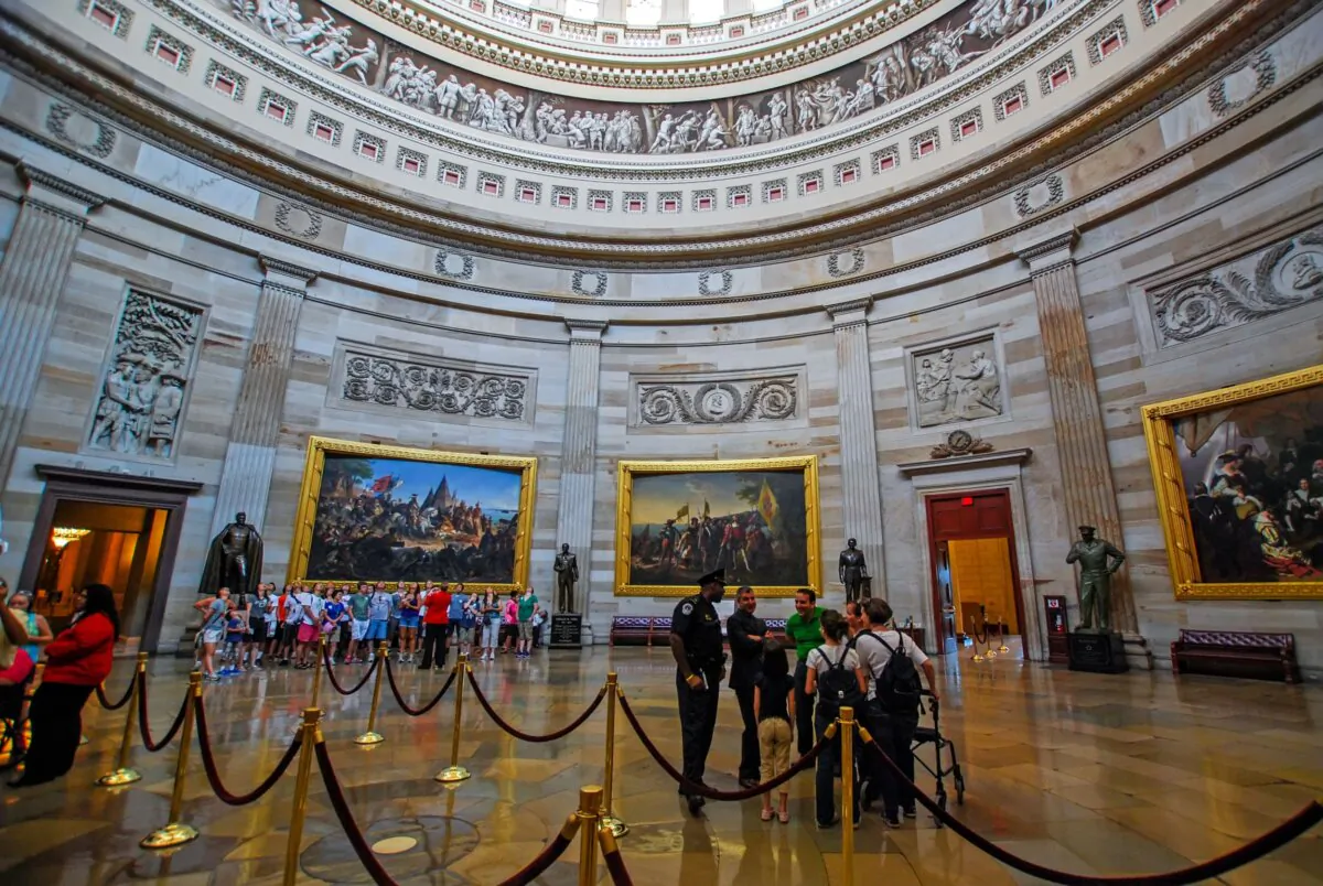 Washington’s Capitol rotunda with visitors. The frieze is near the top of the photo. (Artem Avetisyan/Shutterstock)