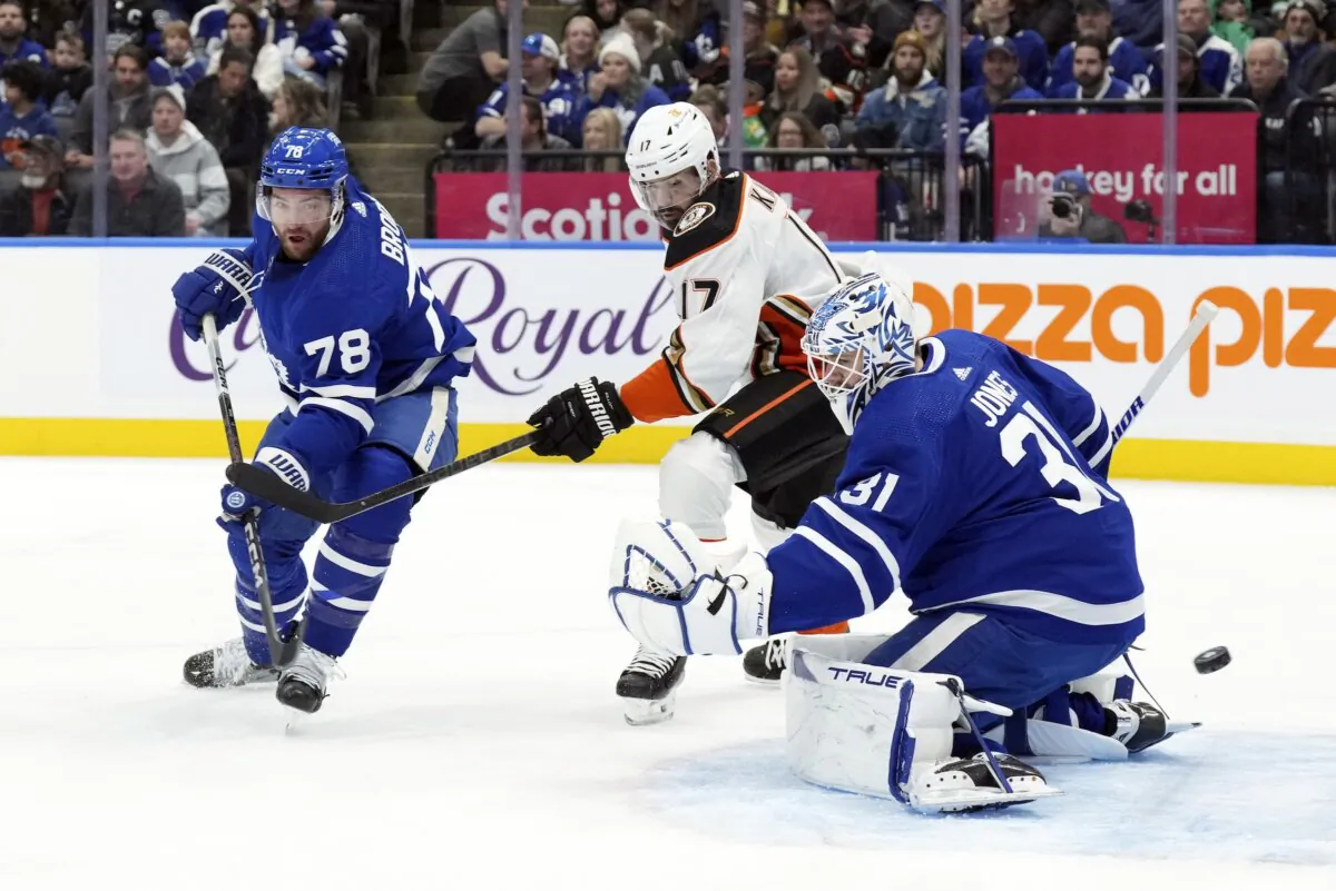 Toronto Maple Leafs goaltender Martin Jones, TJ Brodie (L), and Anaheim Ducks' Alex Killorn watch the puck go wide of the goal during the first period of an NHL hockey game in Toronto on Feb. 17, 2024. (Chris Young/The Canadian Press via AP)