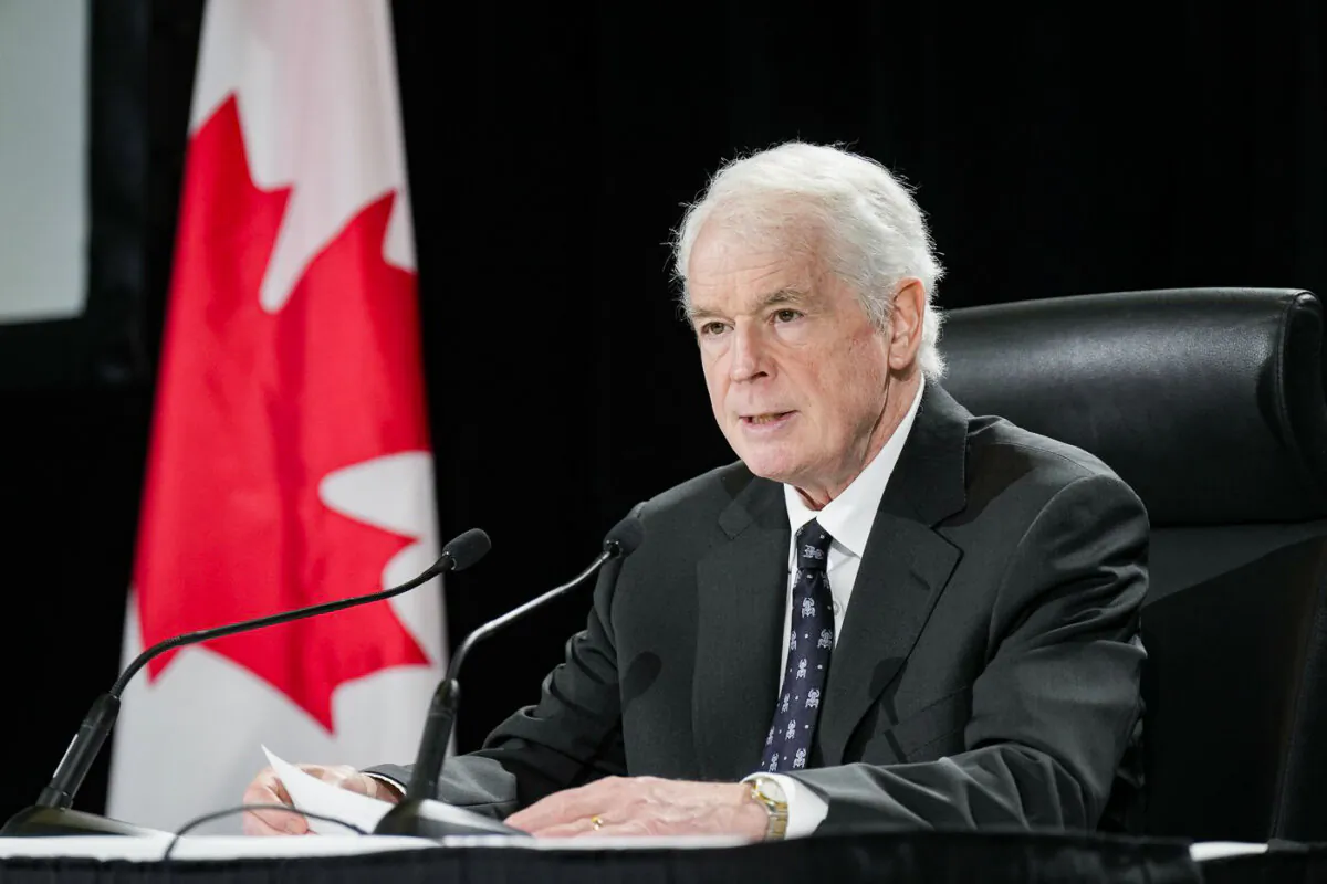 Justice Paul Rouleau releases his report on the Liberal government's use of the Emergencies Act, in Ottawa, on Feb.17, 2023. (The Canadian Press/Adrian Wyld)