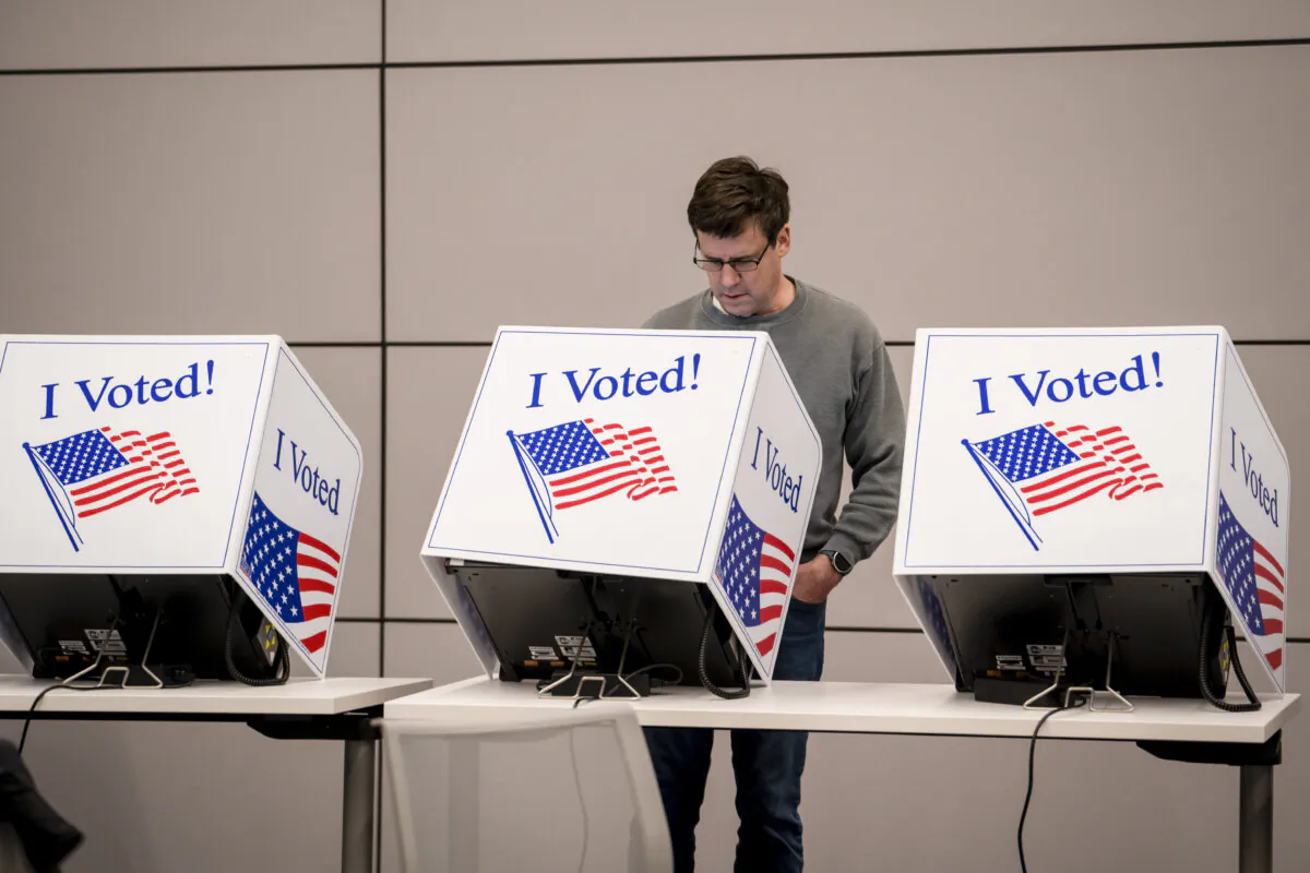 A person votes at an early voting site ahead of the Republican primary election at Wando Mount Pleasant Library in Mount Pleasant, S.C., on Feb. 17, 2024. (Madalina Vasiliu/The Epoch Times)