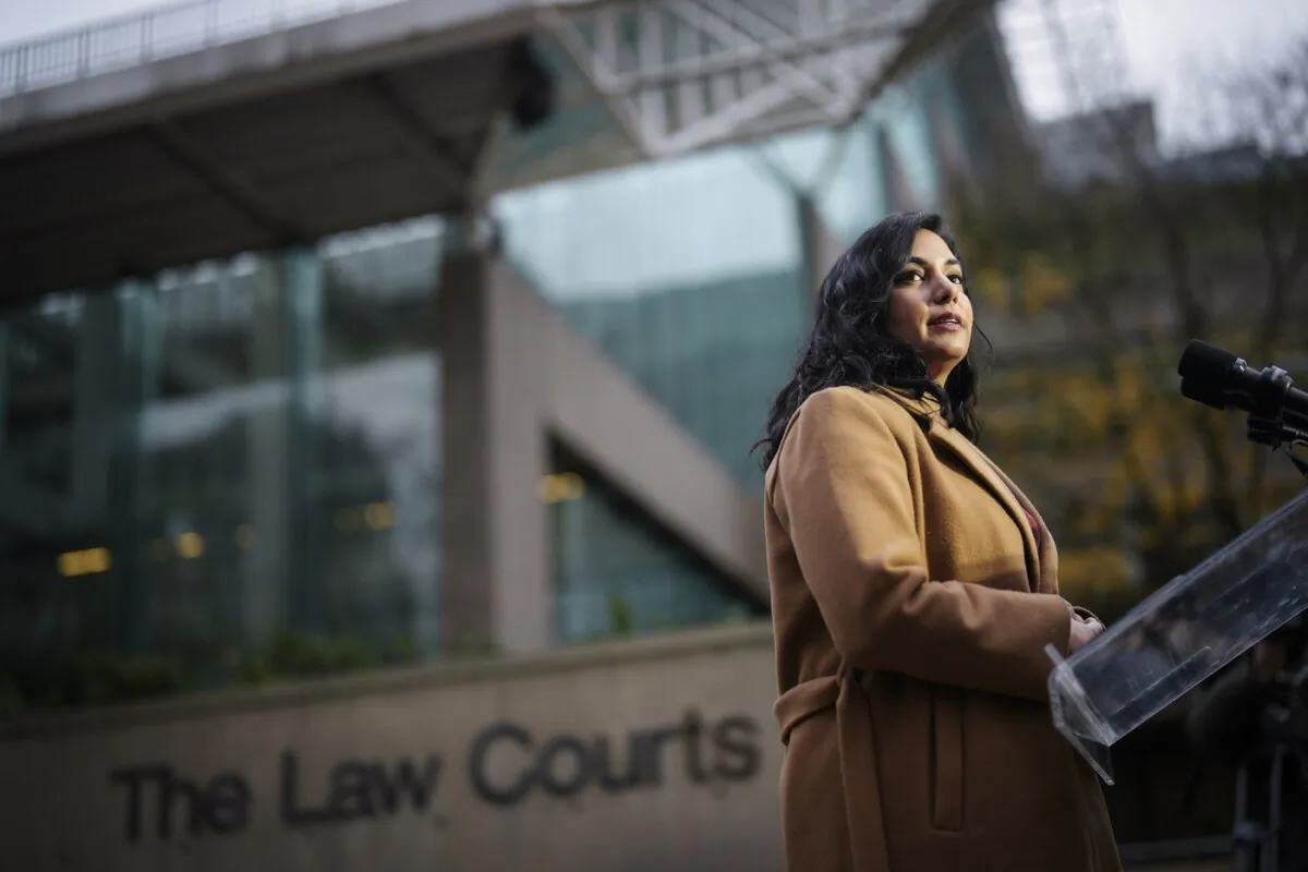 B.C. Attorney General Niki Sharma pauses while responding to questions outside the B.C. Supreme Court in Vancouver on Nov. 27, 2023. (The Canadian Press/Darryl Dyck)