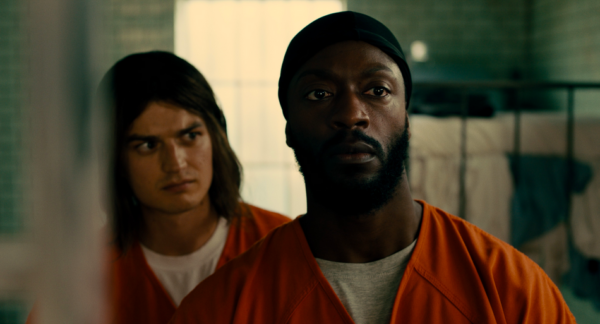 two men in orange jumpsuits in MARMALADE