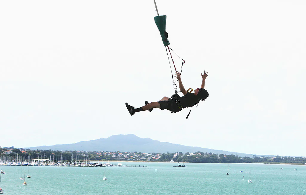 A man enjoys his experience bungee jumping off Auckland Harbour Bridge in Auckland, New Zealand, on Feb. 19, 2009. (Sandra Mu/Getty Images)