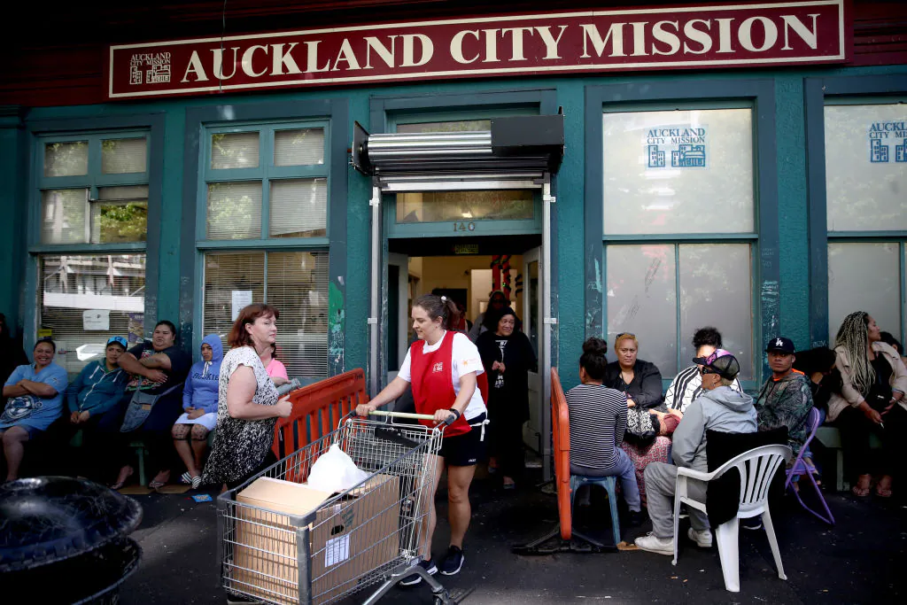 Auckland City Mission volunteers bring out parcels of food and presents for families over Christmas in Auckland, New Zealand on Dec. 13, 2017. (Phil Walter/Getty Images)