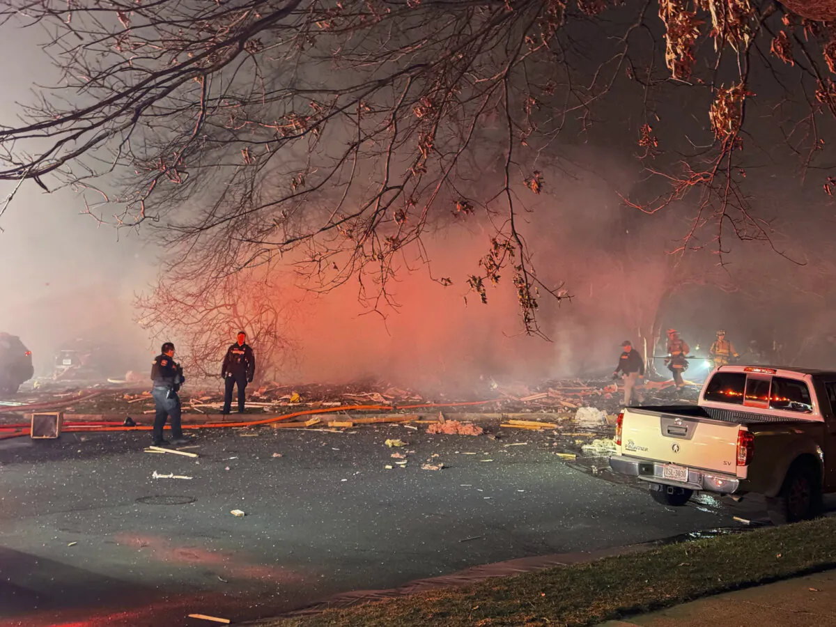 First responders work the scene after an explosion at a house in Sterling, Va., on Feb. 16, 2024. (Nicki Jhabvala/The Washington Post via AP)