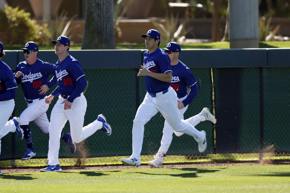 Shohei Ohtani (17) of the Los Angeles Dodgers runs during workouts at Camelback Ranch in Glendale, Ariz., on Feb. 14, 2024. (Chris Coduto/Getty Images)