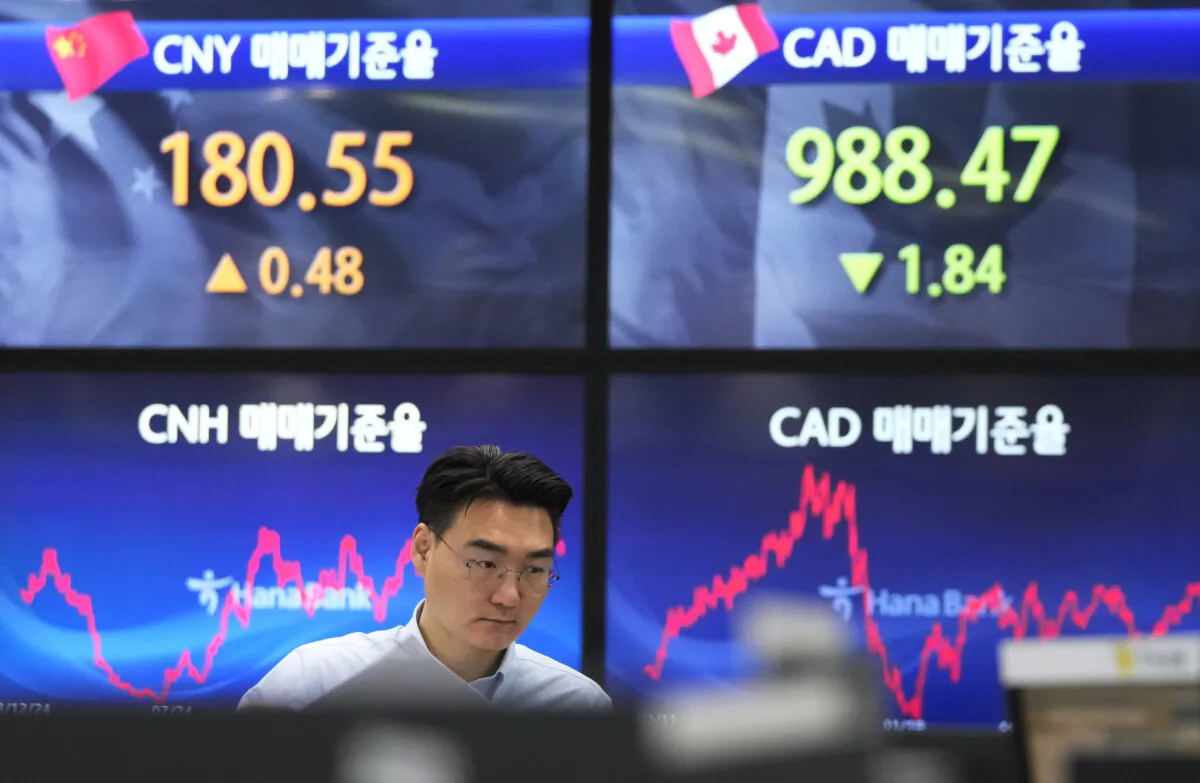 A currency trader watches monitors at the foreign exchange dealing room of the KEB Hana Bank headquarters in Seoul, South Korea, on Feb. 19, 2024. (Ahn Young-joon/AP Photo)