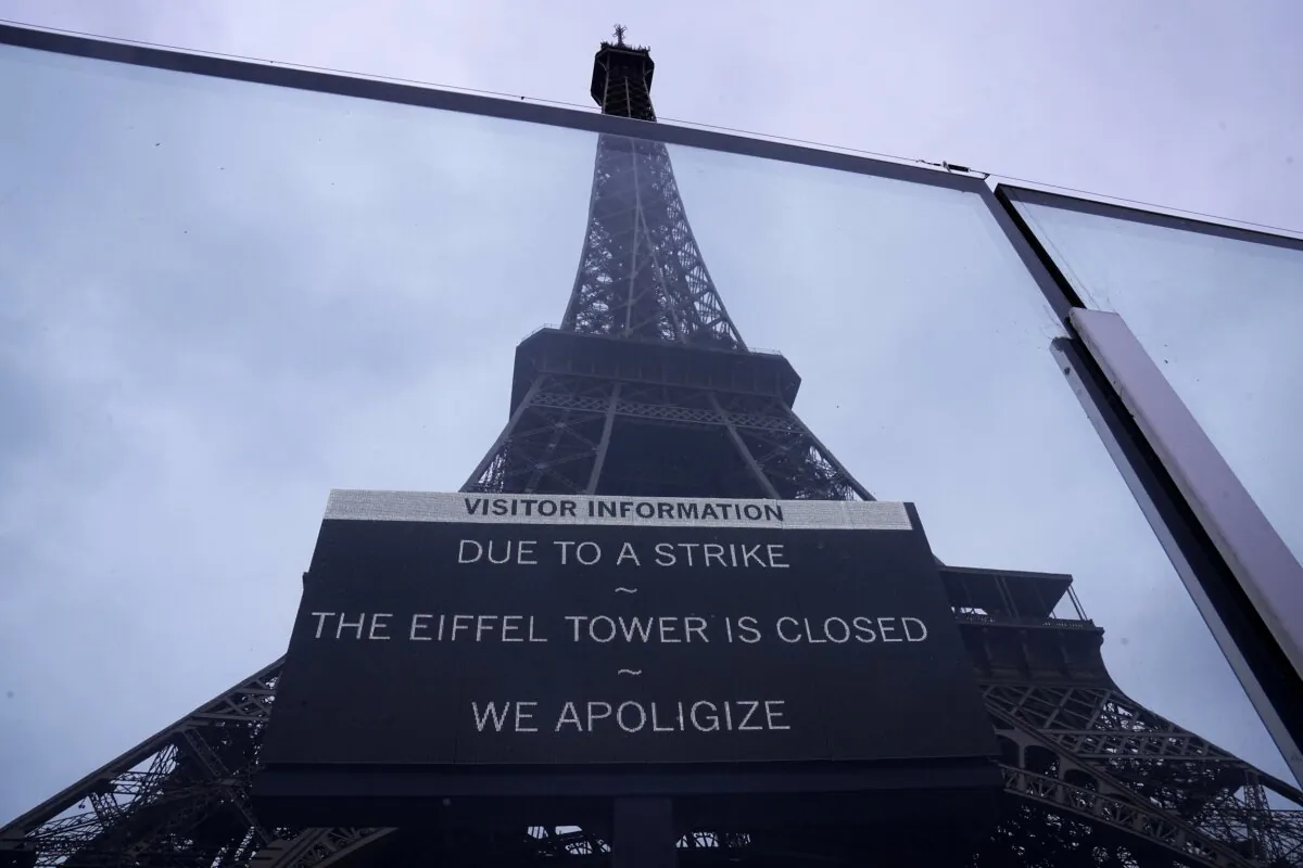 A board advertises a strike at the Eiffel Tower in Paris on Feb. 19, 2024. (Michel Euler/AP Photo)