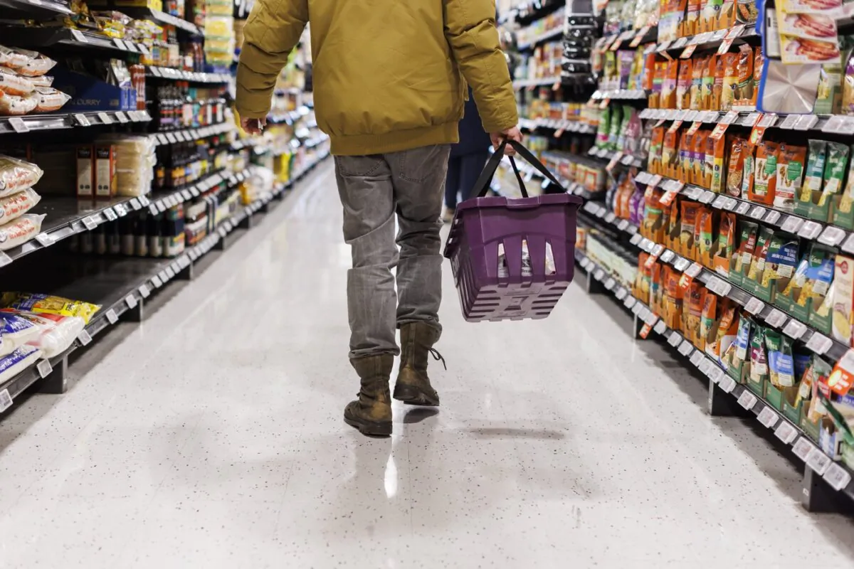 A customer browses an aisle at a Metro grocery store In Toronto on Feb. 2, 2024. (The Canadian Press/Cole Burston)