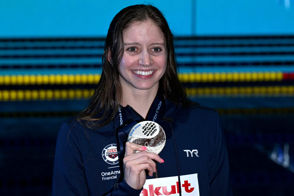 Kate Douglass of the United States poses with her silver medal on the podium of the women's 50m freestyle swimming event during the 2024 World Aquatics Championships at Aspire Dome in Doha, Qatar, on Feb. 18, 2024. (Oli Scarff/AFP via Getty Images)