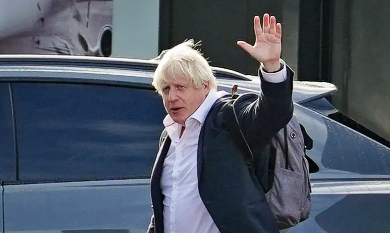 Former Prime Minister Boris Johnson arriving at Gatwick Airport, in London, on Oct. 22, 2022. (Gareth Fuller/PA Media)