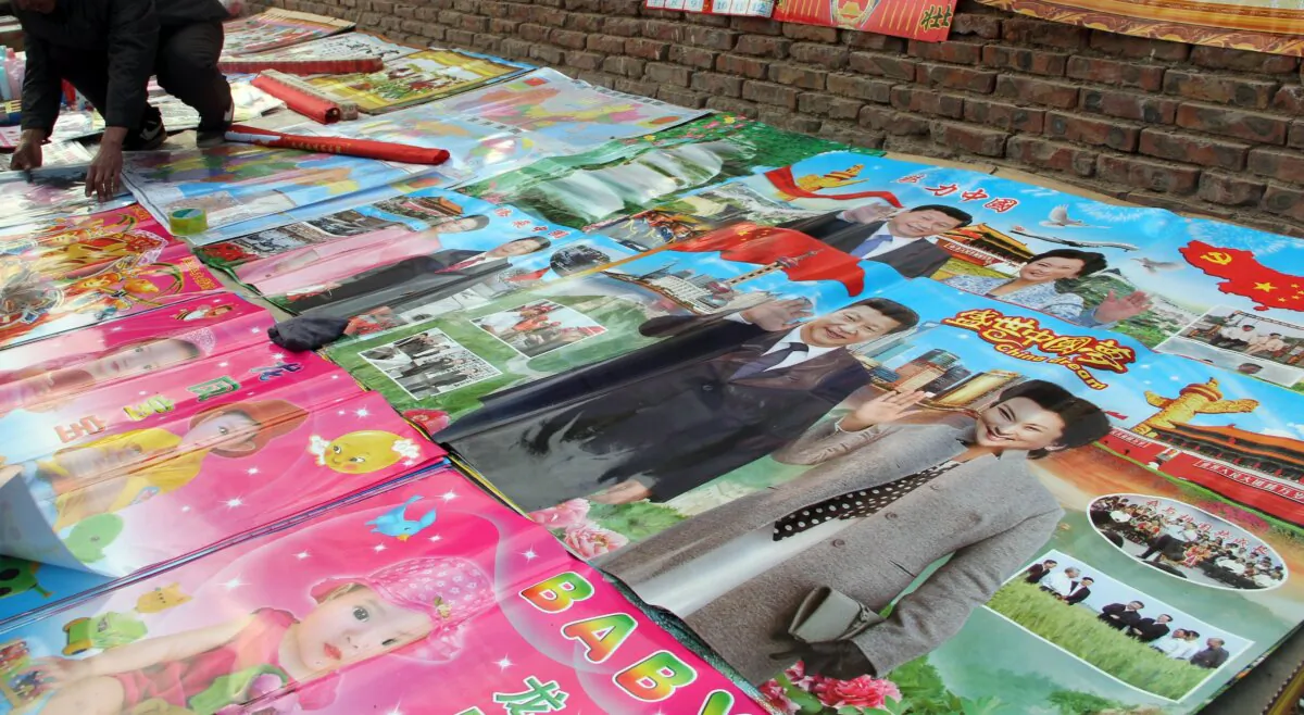 A vendor sells new year pictures for the upcoming Lunar New Year at a market in eastern China's Shandong province on Jan 28, 2016. (STR/AFP via Getty Images)