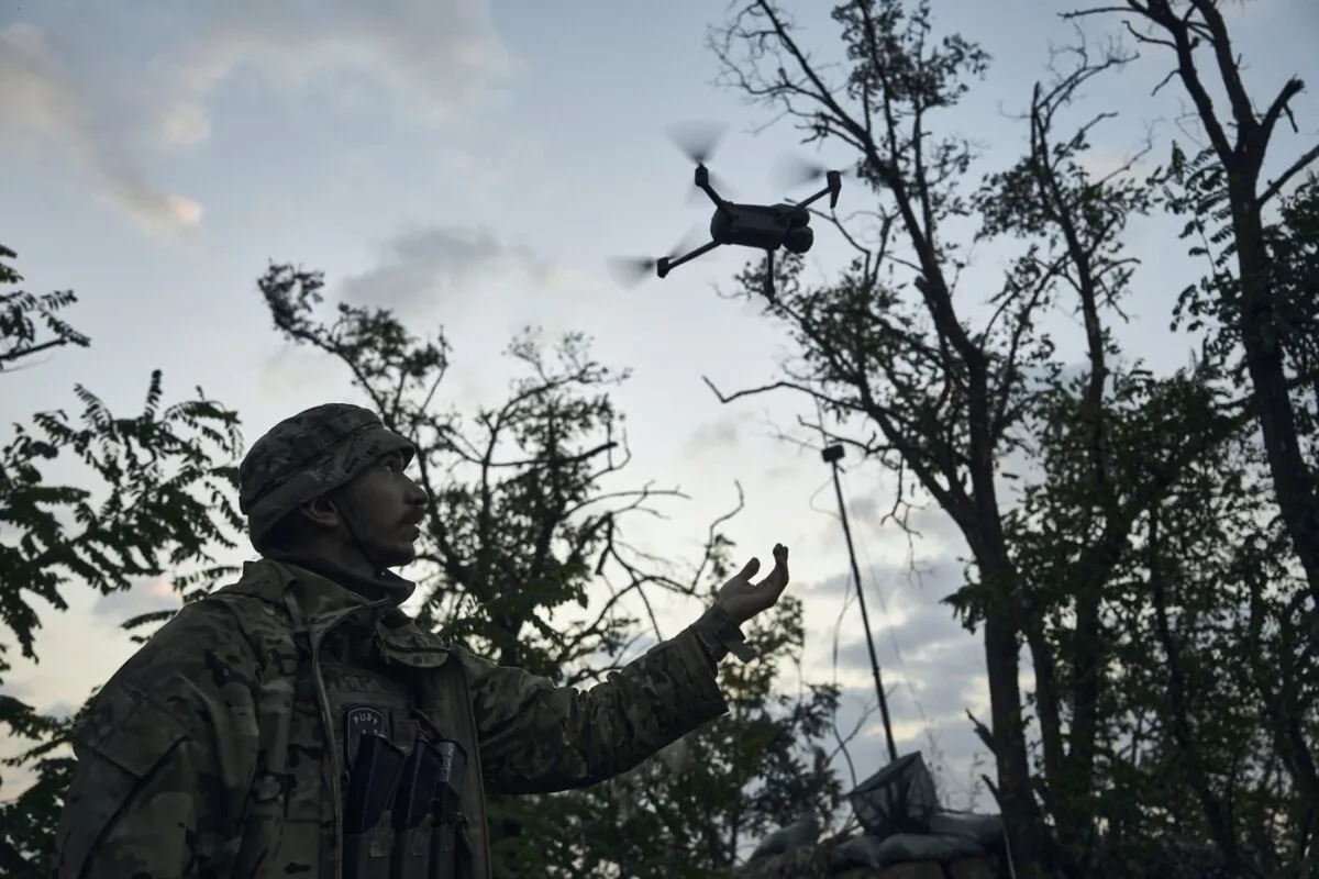 A soldier of Ukraine's 3rd Separate Assault Brigade launches a drone near Bakhmut, the site of fierce battles with the Russian forces in the Donetsk region, Ukraine, on Sept. 3, 2023. (The Canadian Press/AP-Libkos)