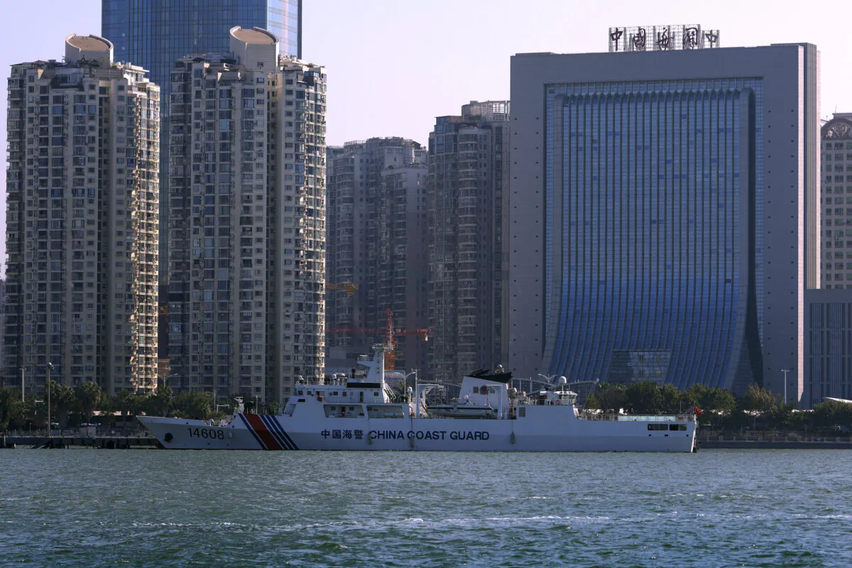 A Chinese Coast Guard ship is docked near a China Customs building in Xiamen in southeast China's Fujian province on Dec. 26, 2023. (Andy Wong/AP Photo)