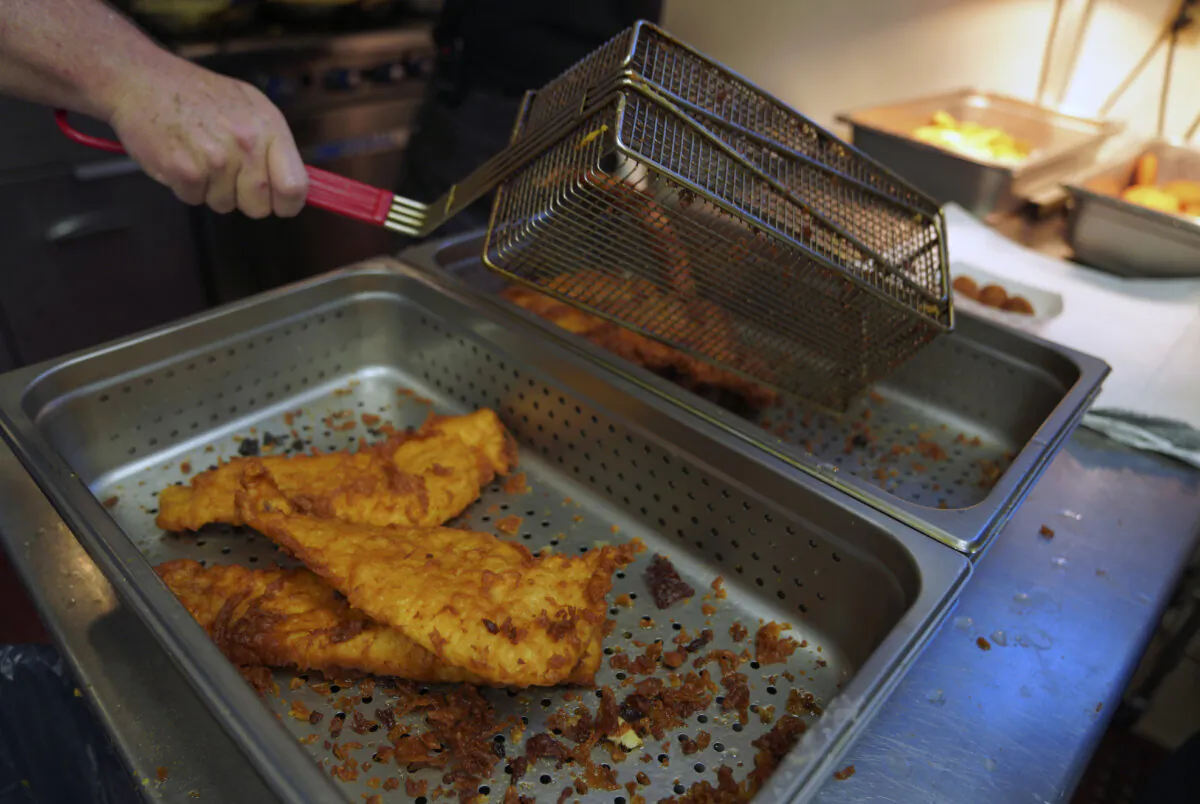 Fried fish is prepared at the Swissvale Fire Department fish fry in Pittsburgh, Pa., on Feb. 24, 2023. Fish fries have been a longtime Catholic tradition in Western Pennsylvania but increased in popularity in 1966 after the Second Vatican Council announced that not eating meat on Fridays was optional, except during Lent. Today they are held anywhere, from churches to fire stations to restaurants. (Jessie Wardarski/AP Photo)