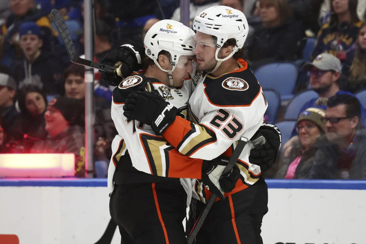 Anaheim Ducks right wing Frank Vatrano (77) celebrates his goal with center Mason McTavish (23) during the second period of an NHL hockey game against the Buffalo Sabres in Buffalo, N.Y., on Feb. 19, 2024. (Jeffrey T. Barnes/AP Photo)