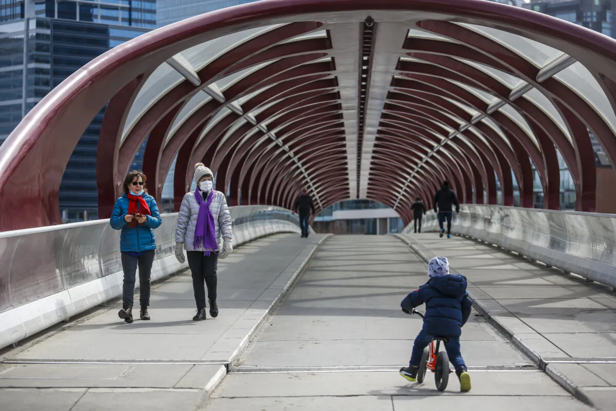 People are seen in downtown Calgary in a file photo. (The Canadian Press/Jeff McIntosh)
